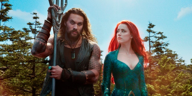 Jason Momoa as Arthur Curry/Aquaman and Amber Heard as Mera.