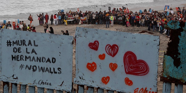 Members of various faith groups showing support for Central American asylum-seekers who arrived in recent caravans. (AP Photo/Rebecca Blackwell)