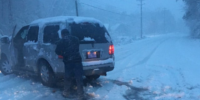 A motorist needed help after at least six inches of snow fell across parts of North Carolina on Sunday.