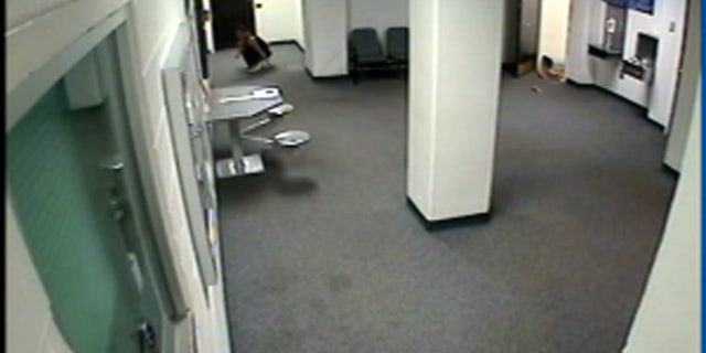 Jessica Leger can be seen dropping from the ceiling into the lobby of the Jefferson County Jail.