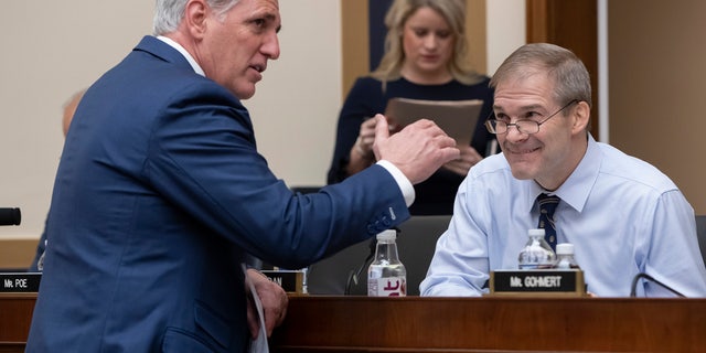 House Majority Leader Kevin McCarthy, R-Calif., left, talks with Rep. Jim Jordan, R-Ohio, before the House Judiciary Committee questions Google CEO Sundar Pichai about the internet giant's privacy security and data collection, on Capitol Hill in Washington, Tuesday, Dec. 11, 2018. (AP Photo/J. Scott Applewhite)