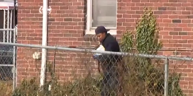 The shooting took place after the man forced three women leaving for church back into a home on Detroit's West Side. A crime scene investigator is seen walking outside the home.