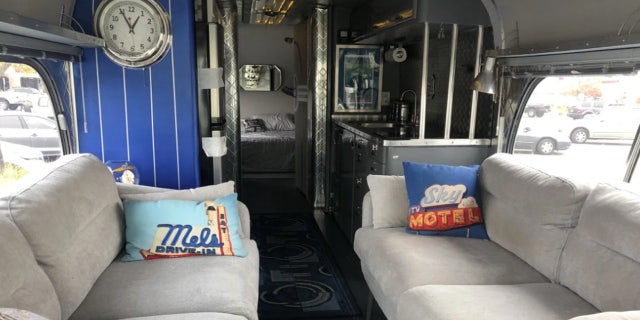 The refurbished bus was the most recent in efforts by Woody Faircloth to help families displaced by the blaze.