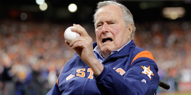 Former President George H.W. Bush threw out a ceremonial first pitch at Game 5 of the World Series between the Houston Astros and Los Angeles Dodgers.