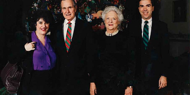 Janet Cawley and her brother Phil, far right, pictured with President George H.W. Bush and first lady Barbara Bush at the White House Christmas party.