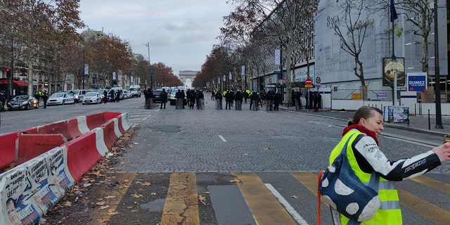 The scene in Paris early Saturday, Dec. 8, 2018, with the Arc de Triomphe far in the background. (Lukas Mikelionis/Fox News)