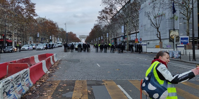 The scene in Paris early Saturday, Dec. 8, 2018, with the Arc de Triomphe far in the background. (Lukas Mikelionis/Fox News)