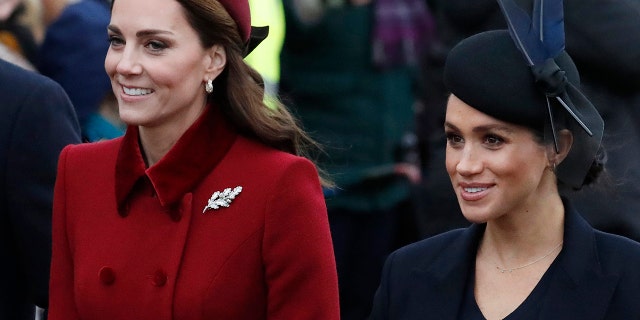 Britain's Kate, Duchess of Cambridge, left, and Meghan Duchess of Sussex, right, are all smiles before attending the Christmas day service at St Mary Magdalene Church in Sandringham in Norfolk, England, Tuesday, Dec. 25, 2018.