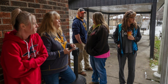 Family and friends await word of the search teams' efforts in finding Cody Beverly, Kayla Williams and Erica Treadway at the Salamy Memorial Center in Whitesville, W.Va., on Wednesday, December 12, 2018.