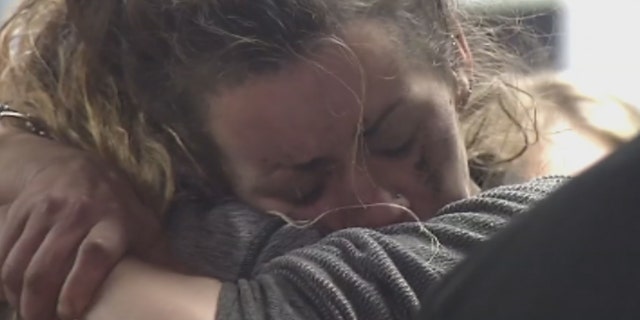 Kayla Williams embraces a loved one after being rescued from the mine on Wednesday.