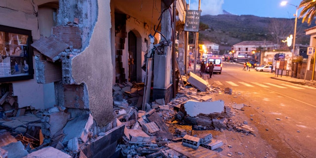 Debris of a partially collapsed house sit on the street in Fleri, Sicily Italy, Wednesday, Dec. 26, 2018.