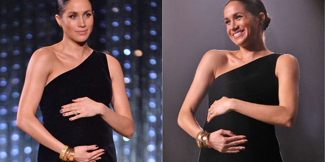 Meghan Markle cradles her baby bump at the 2018 British Fashion Awards.