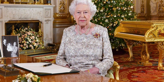 In this photo released on Monday, Dec. 24, 2018, Queen Elizabeth II poses after she recorded her annual Christmas Day message, in the White Drawing Room of Buckingham Palace in central London. (John Stillwell/Pool Photo via AP)