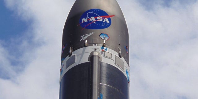 The NASA logo is emblazoned on a Rocket Lab Electron booster ahead of the company's first launch for the U.S. space agency on Dec. 12-13, 2018 from Mahia Peninsula of New Zealand's North Island.
