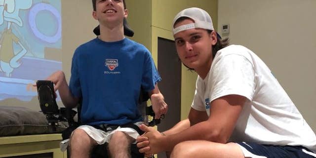 Cooper Dawson (right) let his best friend Kingsley Feinman (left) announce which university he is going to attend next year.
