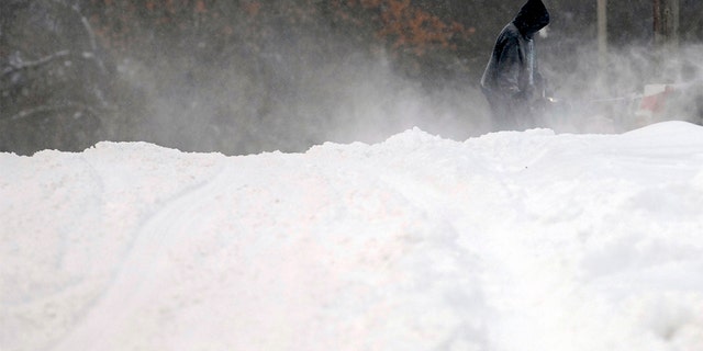 Forecasters posted a blizzard warning for parts of the Dakotas and Minnesota as a major winter storm delivered heavy snow and gusty winds to the region. (Mike McCleary/The Bismarck Tribune via AP)