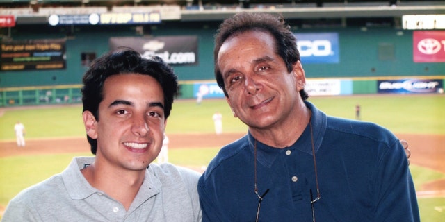 Charles Krauthammer with his son Daniel at RFK Stadium in 2007.