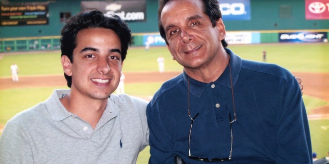 Charles Krauthammer with his son Daniel at RFK Stadium in 2007.