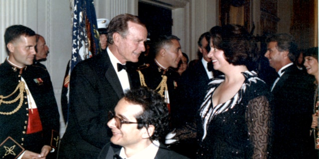Charles Krauthammer with his wife Robyn at the White House with President George H.W. Bush.