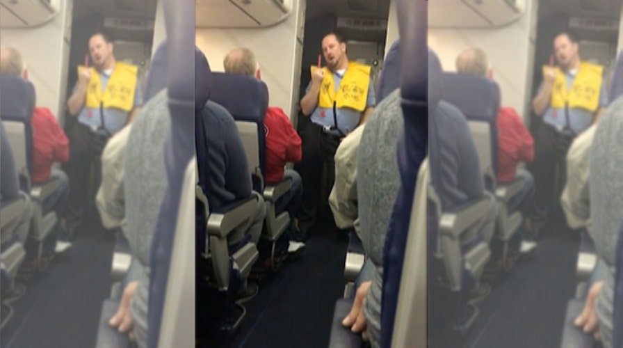 Flight attendant does striptease-like dance during safety demo