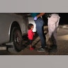 A two-year-old Honduran asylum seeker cries as her mother is searched and detained near the U.S.-Mexico border in McAllen, Texas, June 12, 2018. 