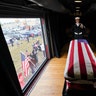 The flag-draped casket of former President George H.W. Bush passes through Magnolia, Texas, Dec. 6, 2018.