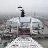 Ahead of the European movie premiere of Mary Poppins Returns, a Mary Poppins stunt double rides atop of the London Eye in central London, Dec. 12, 2018. 