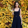 Actress Camilla Belle poses with the signature cocktail for the 2019 Golden Globes, The Moet Belle, at the 76th Golden Globe Awards Show Menu Unveiling in Los Angeles, Calif. on December 13, 3018.