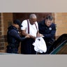Bill Cosby is escorted out of the Montgomery County Correctional Facility following his sentencing for sexual assault in Eagleville, Pennsylvania, September 25, 2018. 