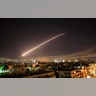 The Damascus sky lights up with missile fire as the U.S. launches an attack on Syria targeting different parts of the capital, April 14, 2018. 