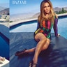 Jennifer Lopez proved yet again she's one sexy mama! The mom of twins stripped down to a sexy blue bathing suit (left) and a $16,830 Balmain dress (right) for Harper's Bazaar. Click here for more pics from her photo shoot.