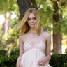 Elle Fanning sparkles in white at The Neon Demon photocall in Rome, Italy on June 6, 2016. Go to X17Online for more pics of Elle.