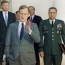 In this Feb. 11, 1991, file photo, President George H.W. Bush talks to reporters in the Rose Garden of the White House after meeting with top military advisors to discuss the Persian Gulf War. From left are, Defense Secretary Dick Cheney, Vice President Dan Quayle, White House Chief of Staff John Sununu, the president, Secretary of State James A. Baker III, and Joint Chiefs Chairman Gen. Colin Powell.