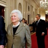In this Jan. 7, 2009, file photo, former President George H. W. Bush, left, walks with his wife, former first lady Barbara Bush, followed by their son, President George W. Bush, and his wife first lady Laura Bush, to a reception in honor of the Points of Light Institute, in the East Room at the White House in Washington.