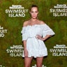 Derek Jeter's wife, Sports Illustrated Swimsuit model Hannah Jeter, was spotted at an exclusive cocktail party at W South Beach’s WET Pool in Miami. The couple welcomed a baby girl in August.