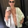 Elizabeth Hurley decided to ditch her bra when she decided to snap a bathroom selfie during a beach getaway. For more photos of Hurley, visit HollywoodLife.com.