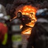 A fire burns inside a car during clashes between police and demonstrators, during demonstration of the "Yellow vests", in Paris, France, on December 8th 2018.