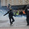 Tear gas is thrown at protesters during clashes with police, during demonstration of the "Yellow vests", in Paris, France, on December 8th 2018.