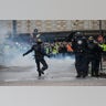 Tear gas is thrown at protesters during clashes with police, during demonstration of the "Yellow vests", in Paris, France, on December 8th 2018.