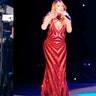 Mariah Carey showed off her curves in a hip-hugging red dress. The singer rocked the red look during her performance at the Dubai Jazz Festival. Her dress is sure to make ex-fiance James Packer jealous. Click here for more pics of Carey on X17Online.com.