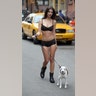 Emily Ratajkowski stopped traffic in NYC in nothing but lingerie while walking a dog. No, the model isn't making a fashion statement -- her risque look was for a commercial shoot for a DKNY campaign. Click here for more pics of the model on ETonline.com.