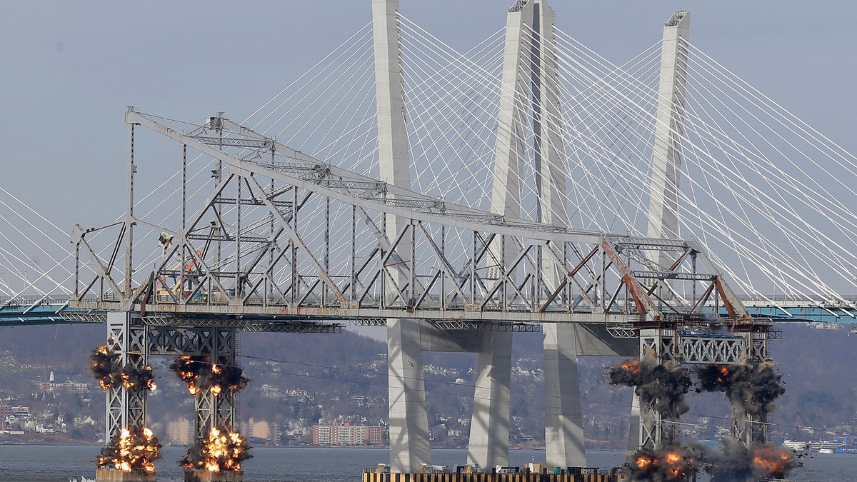 A section of the old Tappan Zee Bridge is brought down with explosives in this view from Tarrytown, N.Y., Tuesday, Jan. 15, 2019. (AP Photo/Seth Wenig)