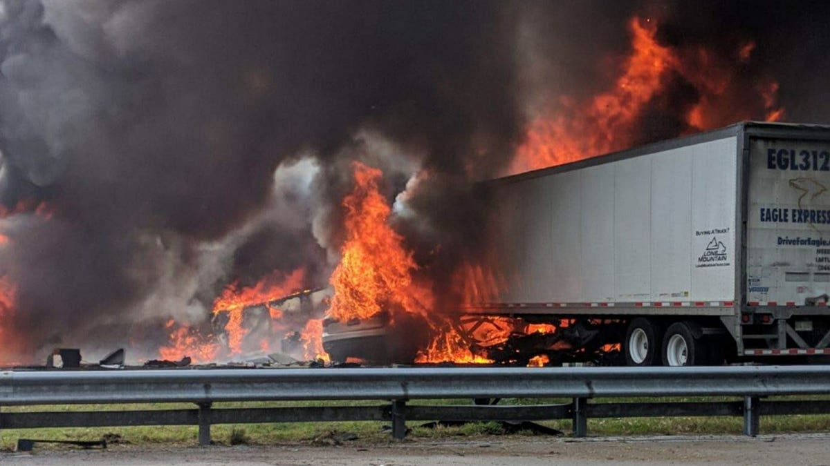 Flames engulf vehicles after a fiery crash along Interstate 75, Thursday, Jan. 3, 2019, about a mile south of Alachua, near Gainesville, Fla.