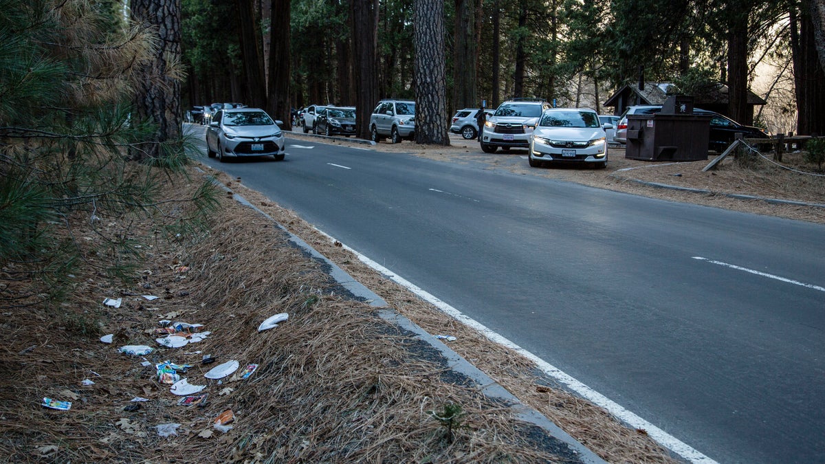 Trash is seen littering a roadside at Yosemite National Park, Calif.