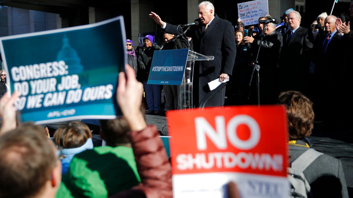 House Majority Leader Rep. Steny Hoyer, D-Md., center on stage, gestures while speaking to union members and other federal employees at a rally to call for an end to the partial government shutdown, Thursday, Jan. 10, 2019, at AFL-CIO Headquarters in Washington. (AP Photo/Pablo Martinez Monsivais)