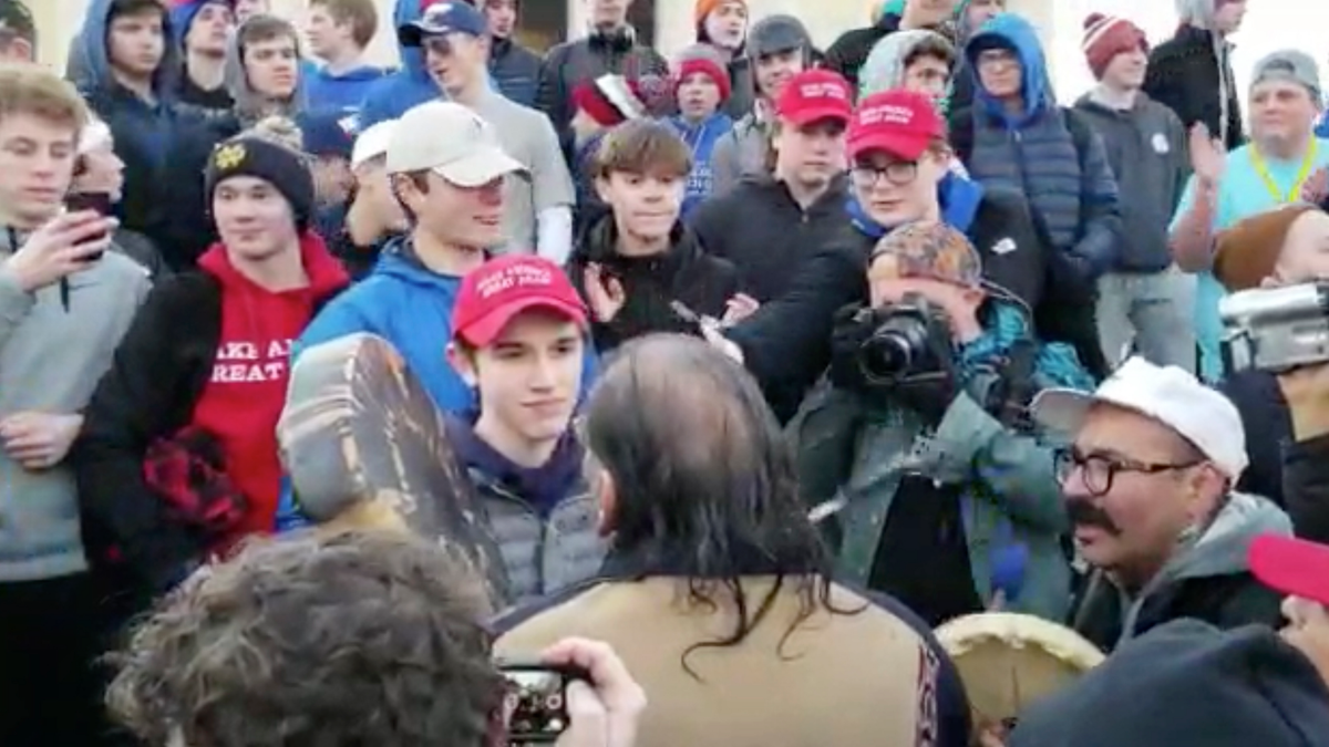 Sandmann and his classmates were vilified on social media for harassing a Native American man until additional footage proved the MAGA-hat wearing kids weren’t the aggressors. (Survival Media Agency via AP)