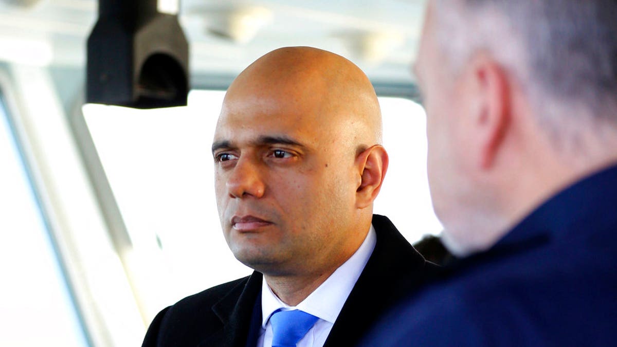 Britain's Home Secretary Sajid Javid, meets Border Force staff on board HMC Searcher, in Dover, England, Wednesday, Jan. 2, 2019.  (Gareth Fuller/PA via AP)