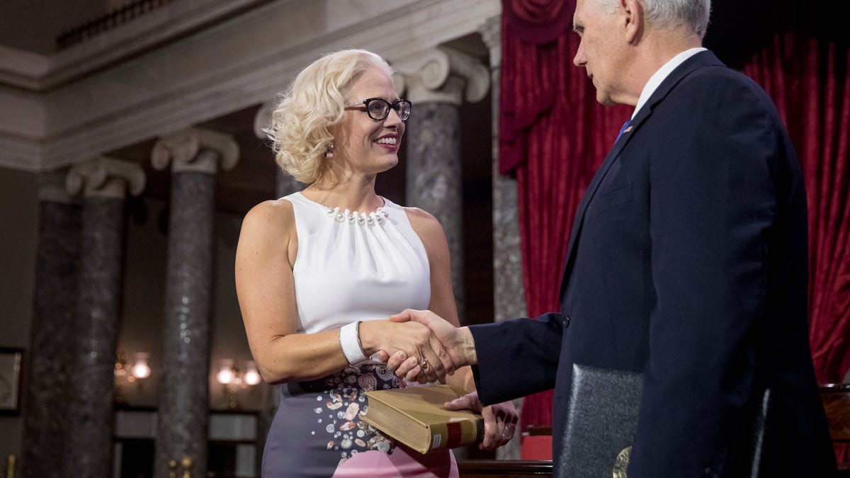 Vice President Mike Pence administers the Senate oath of office to Sen. Kyrsten Sinema, D-Ariz., during a mock swearing in ceremony in the Old Senate Chamber on Capitol Hill in Washington, Thursday, Jan. 3, 2019, as the 116th Congress begins.