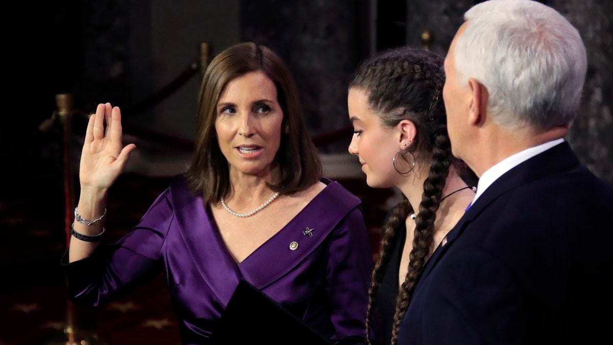 Vice President Mike Pence administers a ceremonial Senate oath during a mock swearing-in ceremony to Sen. Martha McSally, R-Ariz., Thursday, Jan. 3, 2019, in the Old Senate Chamber on Capitol Hill in Washington. (AP Photo/Manuel Balce Ceneta)