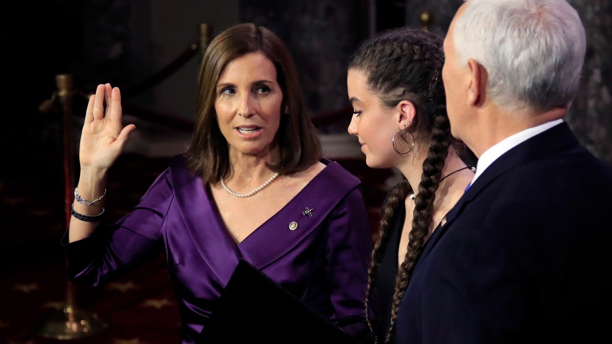 Vice President Mike Pence administers a ceremonial Senate oath during a mock swearing-in ceremony to Sen. Martha McSally, R-Ariz., Thursday, Jan. 3, 2019, in the Old Senate Chamber on Capitol Hill in Washington. (AP Photo/Manuel Balce Ceneta)